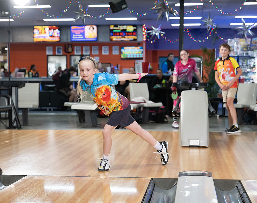 Kids participating in a competition at Sunset Superbowl.